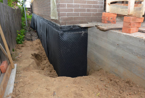 Happy homeowners after waterproofing job in Pine River
